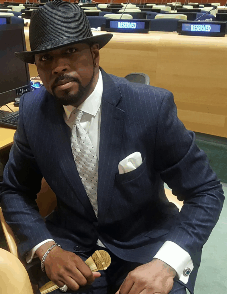 MC Euneek (of Maestro Beats) in a suit and hat